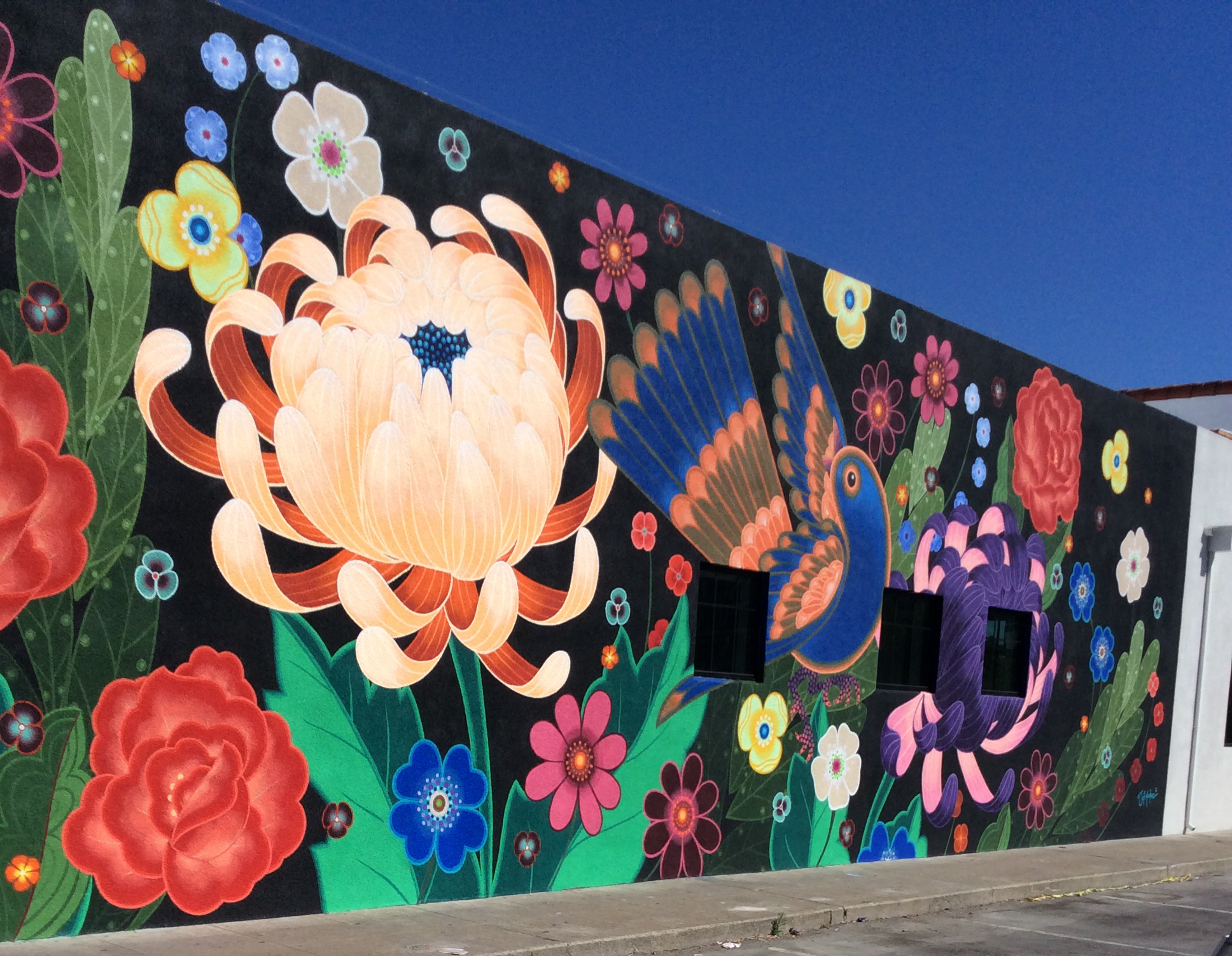 Colorful 100-foot-long mural brightens downtown Redwood City
