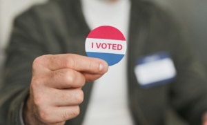 Photo by Edmond Dantès: https://www.pexels.com/photo/a-person-holding-a-badge-with-i-voted-7103133/