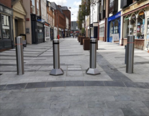 Bollards being installed on Theatre Way to enhance outdoor dining, pedestrian safety